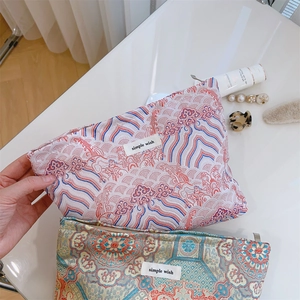 Detail of traditional Chinese pattern cosmetic bags with waves and floral brocade patterns