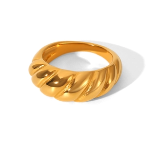 Detailed close-up of a polished gold-plated stainless steel twisted croissant dome ring