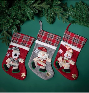 Three festive Christmas stockings featuring polar bear, Santa Claus, and snowman with stars