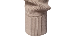 Macro shot of khaki knitted ribbed cuffs with detailed stitching on long sleeve sweater