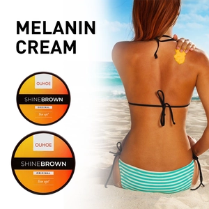 OUHOE SHINEBROWN melanin cream for tan skin and a woman applying cream on beach