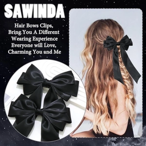 Detail of elegant black satin bow hair clips in a 2-piece set for stylish hair styling