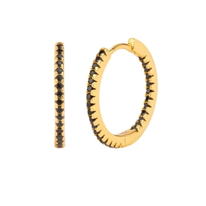 Macro view of gold hoop earrings with black micro-pave cubic zirconia gemstones
