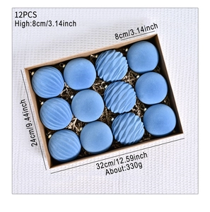 Detail view of 12pcs 8cm blue flocked Christmas ornaments with smooth and wavy texture