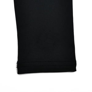 Detail view showing the durable double-stitched cuff on the black long sleeve shapewear bodysuit