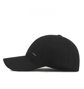 Detail of men's winter baseball cap with silver Fashion tag and knit texture