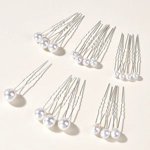 Set of 18 silver U-shaped hair pins with round white pearls for elegant bridal hair styling