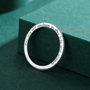 S925 sterling silver turquoise ring with soulmate engraving on a green background
