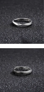 Detail of silver Mobius twist and brushed texture adjustable rings for men