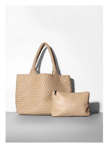 Detail view of woven tote bag with matching zipper pouch in beige textured faux leather