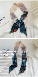 Artistic oil painting style narrow silk scarf shown tied as a bow on a white shirt