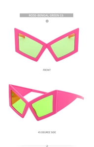 Front and 45-degree views of geometric pink frame sunglasses with green lenses