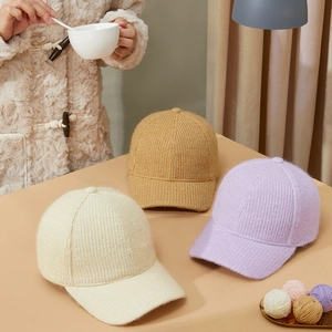 Winter knitted baseball caps in beige, camel and lilac colors with warm fleece lining