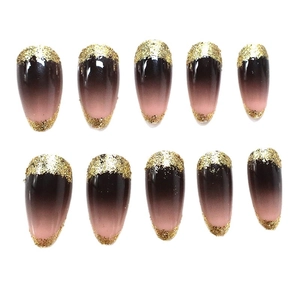 Glittery gradient almond press-on nails with golden sparkles and pink to black transition
