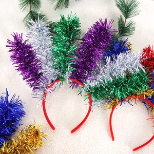 Festive Mardi Gras tinsel headbands in vibrant purple, gold, and green party colors