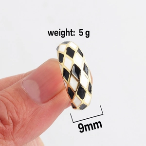 Minimalist gold ring with black and white checkered enamel design and adjustable open band