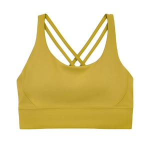 Dettaglio del reggiseno sportivo giallo senape con spalline incrociate e tessuto senza cuciture
