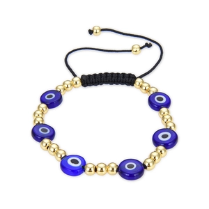 Handmade woven Evil Eye bracelet with blue glass beads and golden metal accents