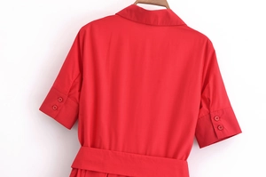 Back view of red poplin dress featuring a waist tie and short sleeves on white background