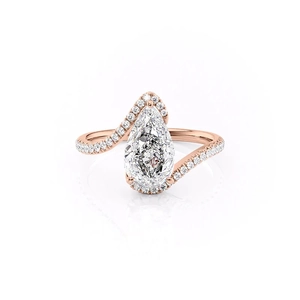 Detail of rose gold pear-shaped diamond ring with micro-pave cubic zirconia setting