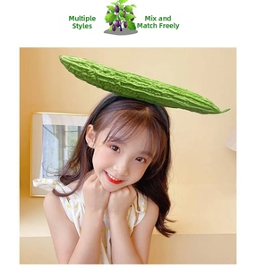 Detailed view of a green bitter melon vegetable headband on a model for fun photo prop