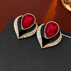 Vintage gold-plated heart earrings with red teardrop gemstone and black enamel