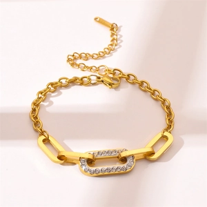 Golden titanium steel chain bracelet with crystal oval link and secure lobster clasp