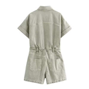 Detail view of the back of a short-sleeved denim romper with elastic waist in sage green
