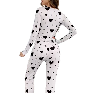 Women's rib-knit pajama set featuring black heart print and long sleeves from back view