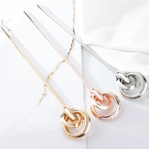 Minimalist metal hair sticks in gold rose gold and silver with knot design on marble