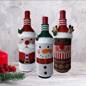 Three-piece Christmas wine bottle covers featuring Santa, Snowman and Reindeer motifs