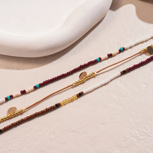 Detail of colorful beaded waist chains with golden sequins and vintage glass beads