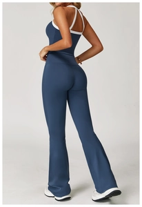 Rear view of high-waisted flared yoga pants and dark blue racerback sports tank top