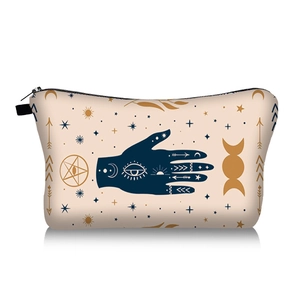 Detailed view of the mystical Evil Eye and Hamsa Hand print on a beige cosmetic bag