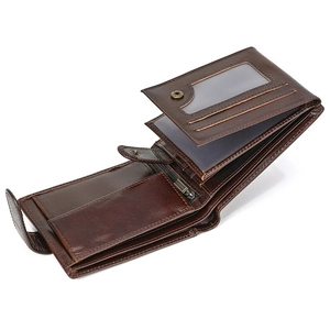Interior detail of a dark brown leather trifold wallet with card slots and coin pocket