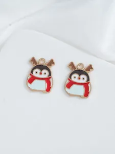 Macro view of cute Christmas penguin enamel charms with elk antlers for DIY jewelry making