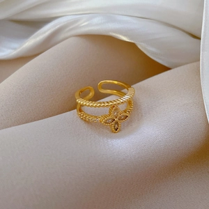 Golden double-layer open ring featuring a sparkling clover flower set with cubic zirconia