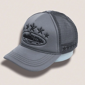 Close-up of black star embroidery and breathable mesh on a gray adjustable trucker hat