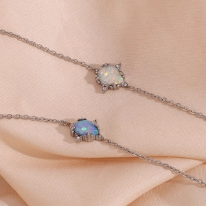 Exquisite stainless steel pear opal pendant chain detail close-up showing fine craftsmanship.