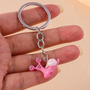 Pink cartoon snail keychain with silver metal ring, cute animal backpack accessory charm