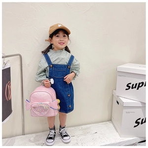 Pink sequin backpack for girls featuring transparent heart pocket and bow details