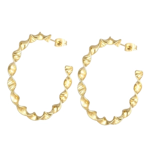 Polished gold twisted hoop earrings with minimalist french wave texture on white background