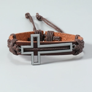 Detailed close-up of brown braided leather strap with metal cross ornament for men