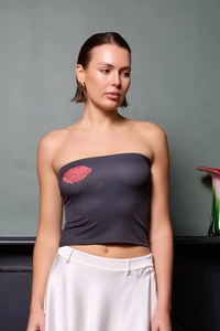 Detail of grey strapless tube top with a large red rose print on the front