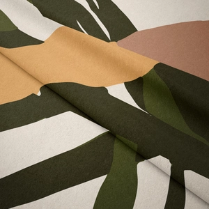 Macro detail of soft flannel fabric featuring Nordic botanical leaf patterns in mustard and green