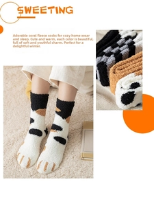 Detail of plush coral fleece cat paw socks showing thick texture and warm winter material