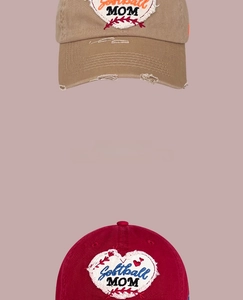 Detail of vintage washed cotton baseball caps with embroidered Softball MOM heart patches