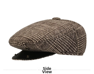 Side view of a vintage plaid flat cap with a black leather brim and golden rivets