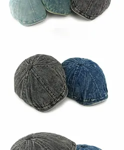 Detail van uit meerdere panelen gestikte denim newsboy caps in diverse vintage wassingen
