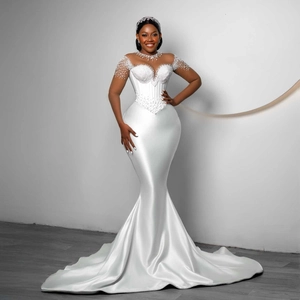 Elegant white mermaid satin wedding dress with pearl beaded bodice and heart neckline